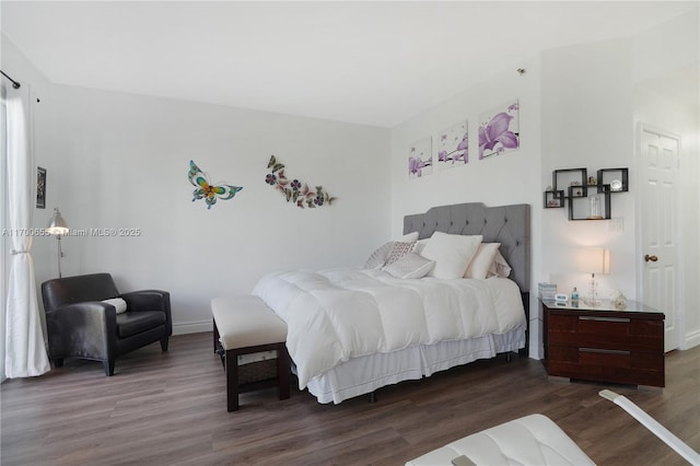 bedroom featuring dark wood-type flooring