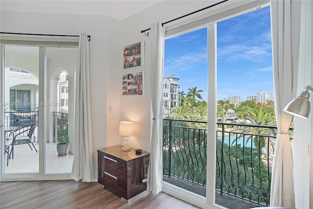 doorway with hardwood / wood-style flooring