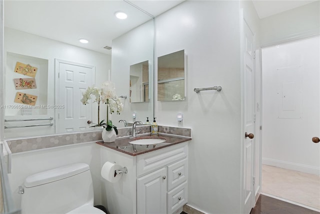 bathroom with vanity and toilet