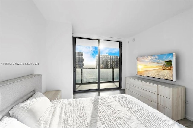 bedroom featuring access to outside and expansive windows