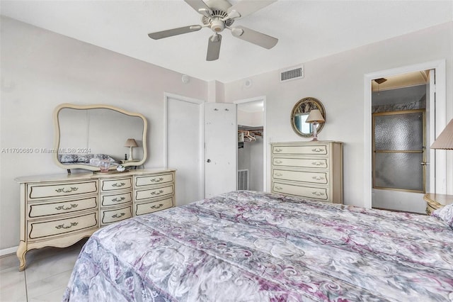 tiled bedroom with ceiling fan