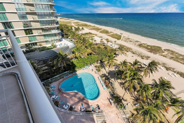 birds eye view of property with a water view and a view of the beach