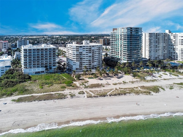 bird's eye view with a view of the beach and a water view