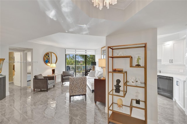 living room with floor to ceiling windows and ornamental molding