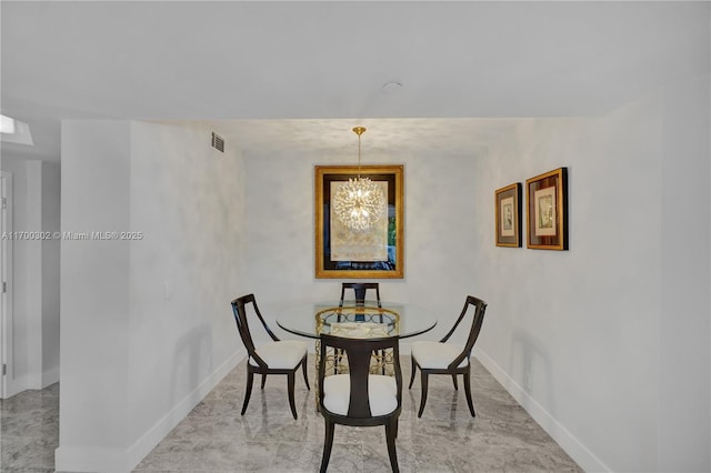 dining area with a chandelier