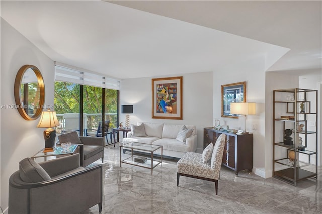 living room featuring floor to ceiling windows