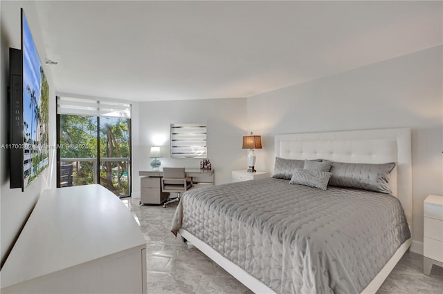 bedroom featuring a wall of windows