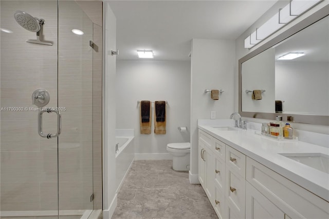 full bathroom featuring vanity, toilet, and independent shower and bath