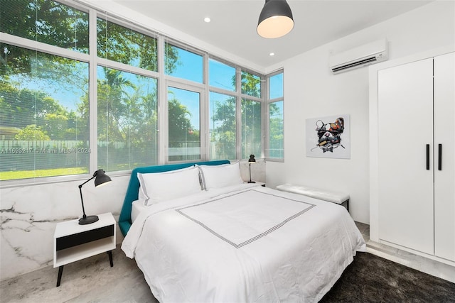 bedroom featuring an AC wall unit