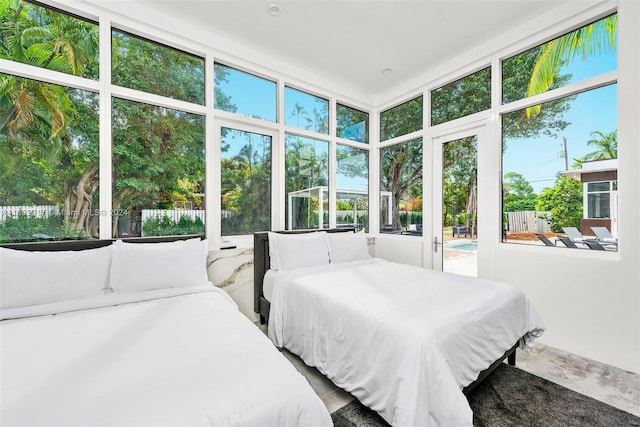 bedroom featuring access to outside and multiple windows