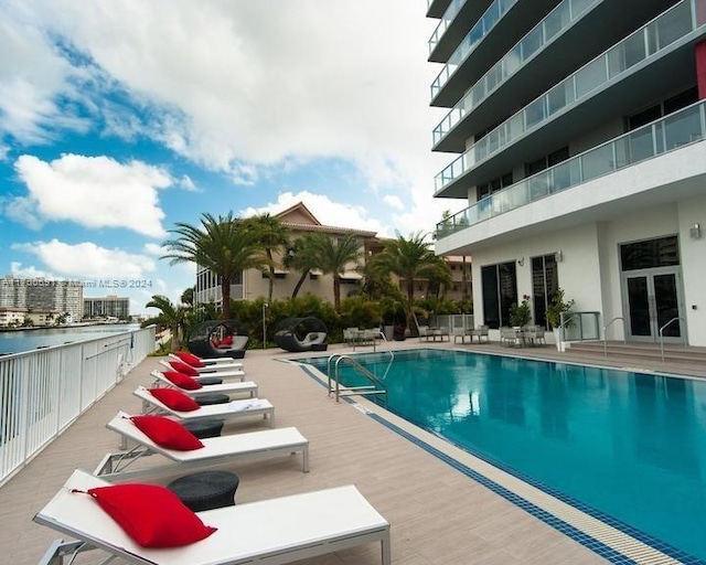 view of swimming pool with a patio