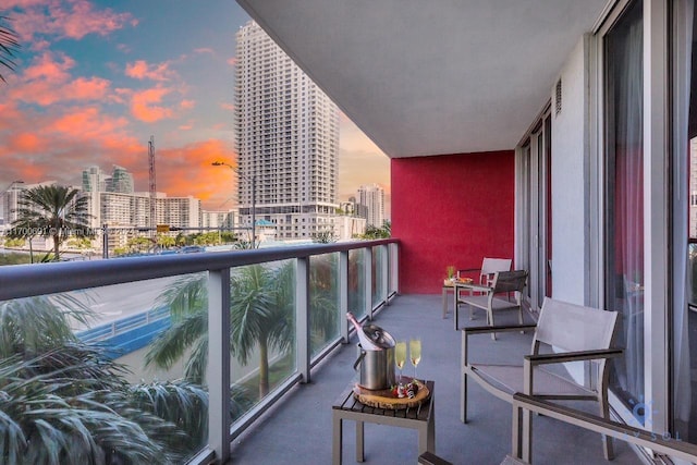 view of balcony at dusk