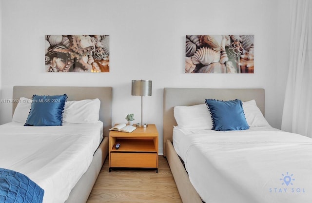 bedroom featuring light wood-type flooring