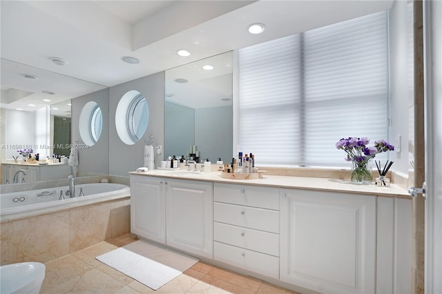 bathroom with vanity, tiled bath, and tile patterned floors