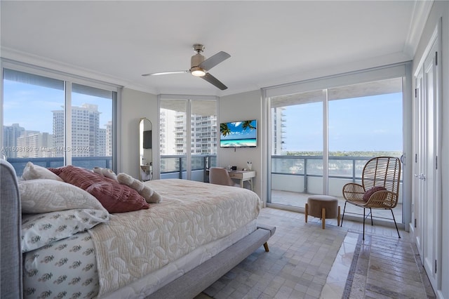 bedroom featuring hardwood / wood-style flooring, ceiling fan, ornamental molding, and multiple windows