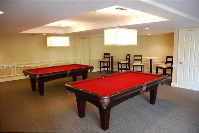 recreation room with a raised ceiling, carpet flooring, a healthy amount of sunlight, and billiards