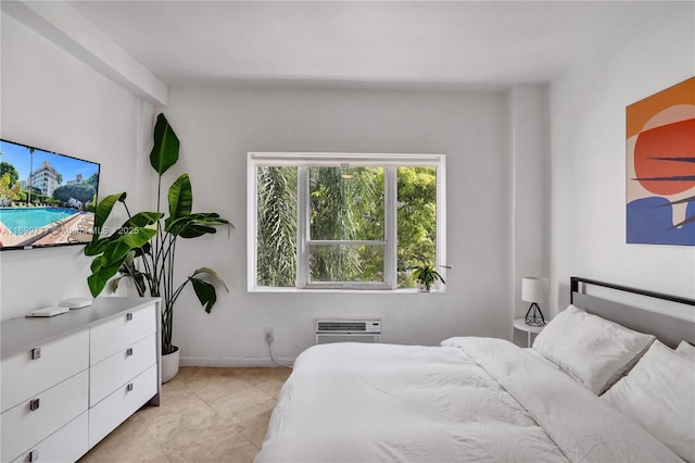 bedroom featuring a wall unit AC