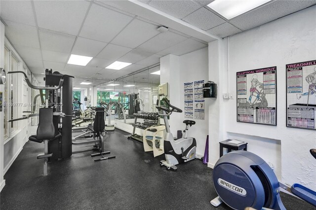 workout area with a drop ceiling