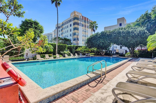 view of swimming pool featuring a patio area