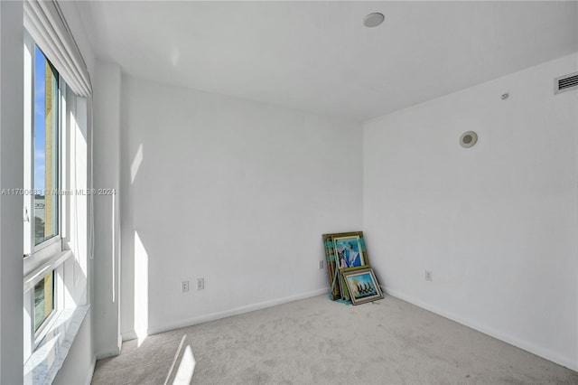 empty room with light colored carpet