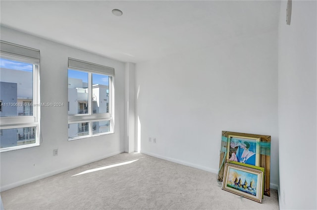 empty room with light colored carpet