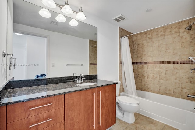 full bathroom with tile patterned flooring, vanity, toilet, and shower / bath combo