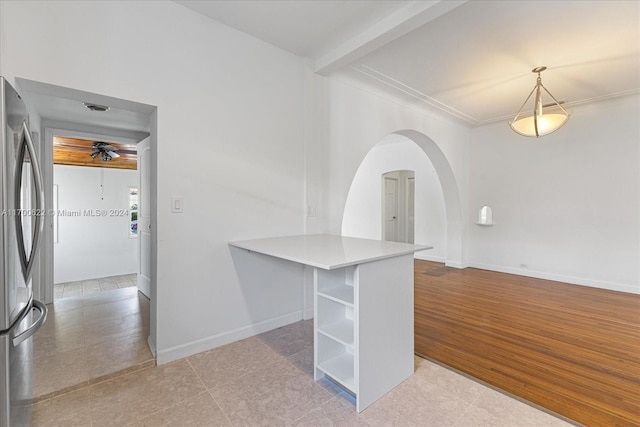 interior space with ceiling fan, light wood-type flooring, and ornamental molding