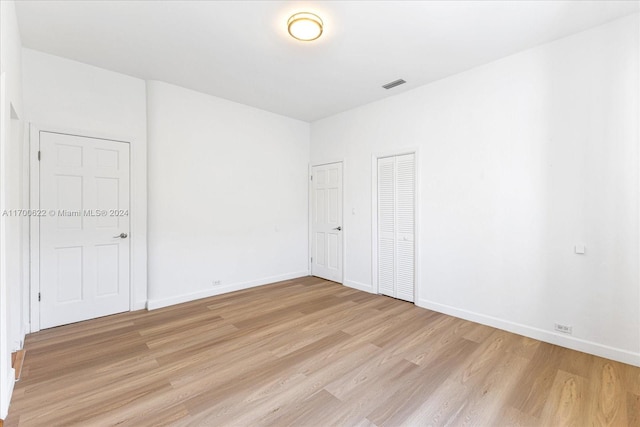 spare room with light wood-type flooring