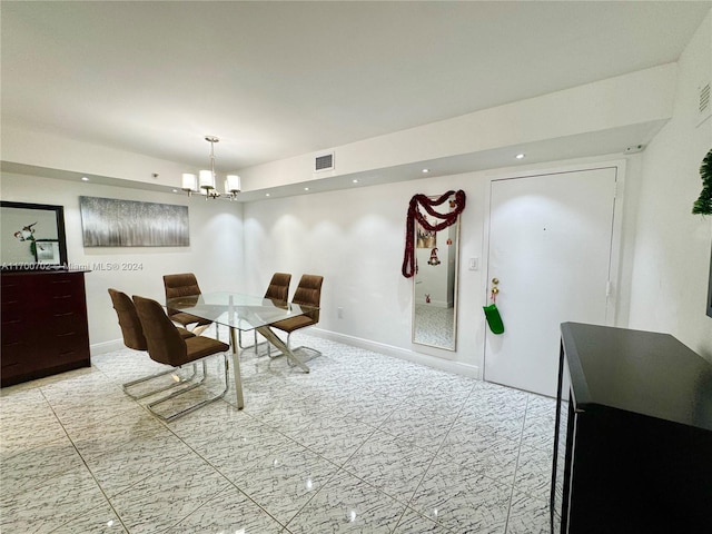 dining room with a notable chandelier