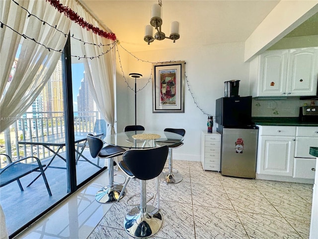 dining space featuring a notable chandelier