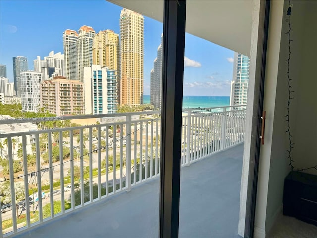 balcony featuring a water view