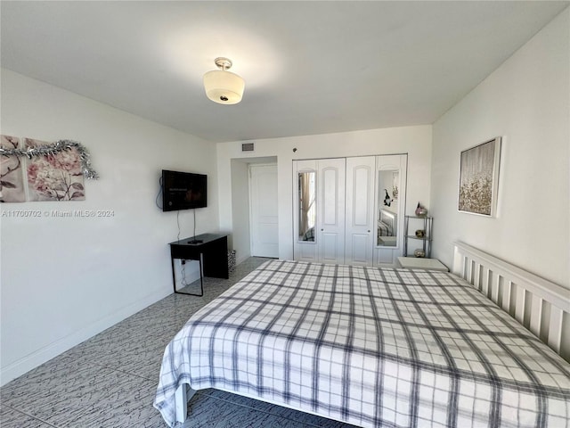 carpeted bedroom featuring a closet