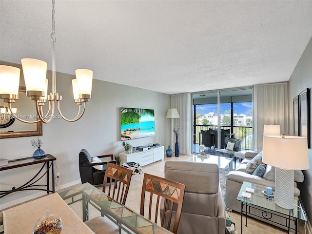 living room with a wall of windows, a textured ceiling, and a notable chandelier