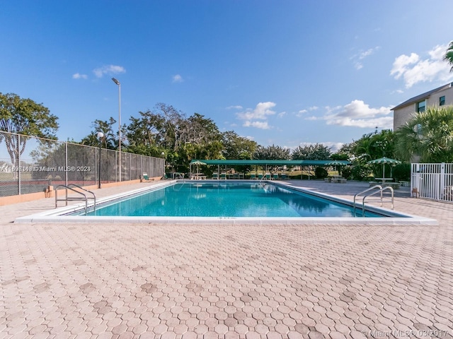 view of swimming pool featuring a patio