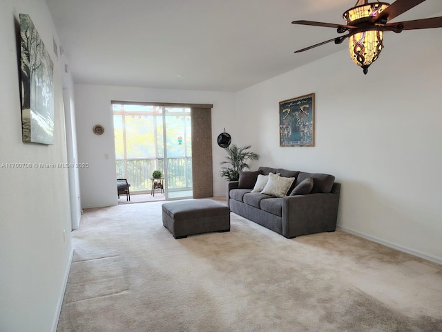 living room featuring ceiling fan and light colored carpet