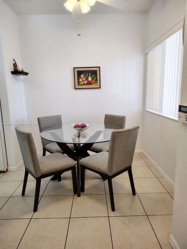 tiled dining room with ceiling fan