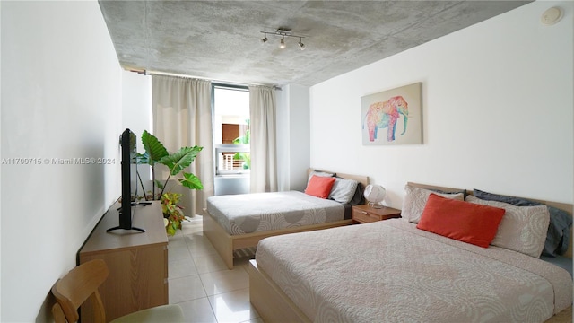 tiled bedroom with rail lighting