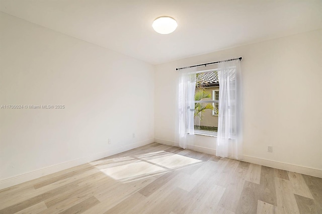 empty room with light wood-type flooring