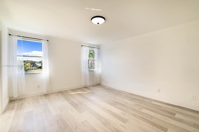 unfurnished room featuring light hardwood / wood-style floors