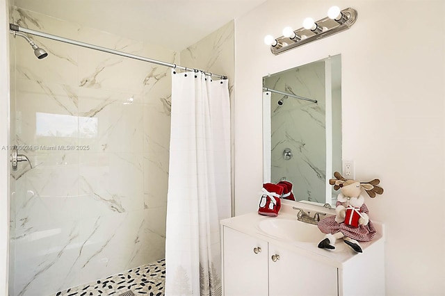 bathroom featuring curtained shower and vanity