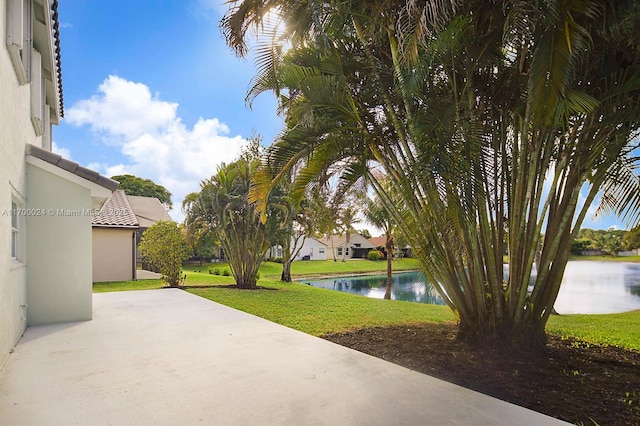 view of patio with a water view