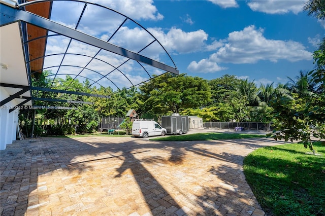 view of patio / terrace with a trampoline and a shed