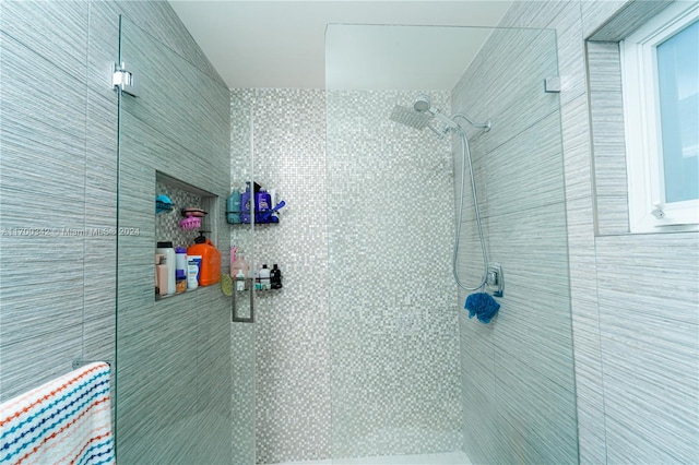 bathroom with a tile shower