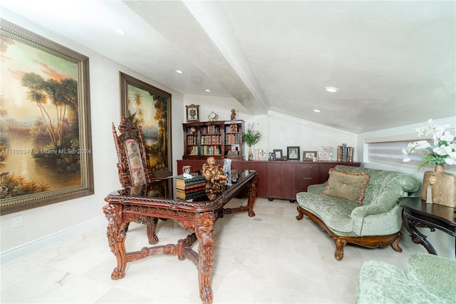 office area with vaulted ceiling