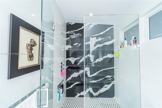 bathroom with tile patterned floors and walk in shower