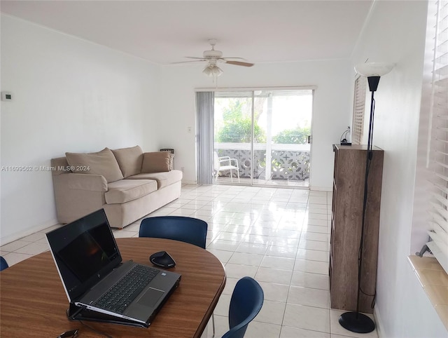 living room with ceiling fan and light tile patterned flooring