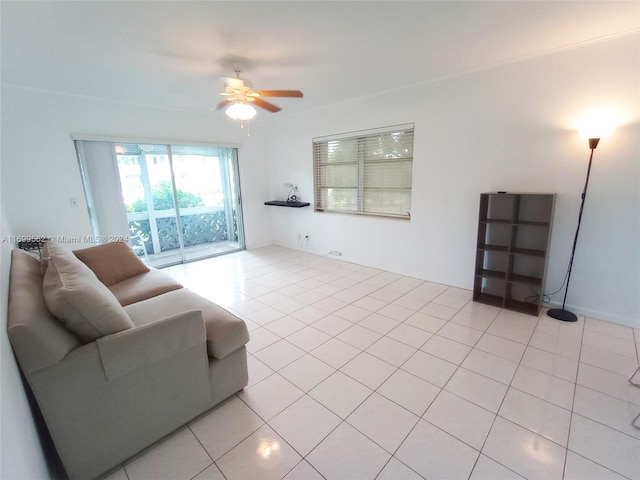 tiled living room with ceiling fan