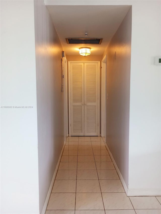 hallway with light tile patterned flooring