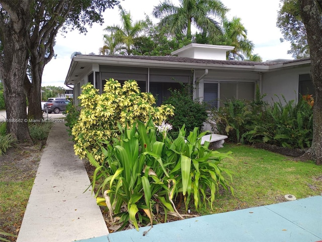 view of home's exterior featuring a sunroom