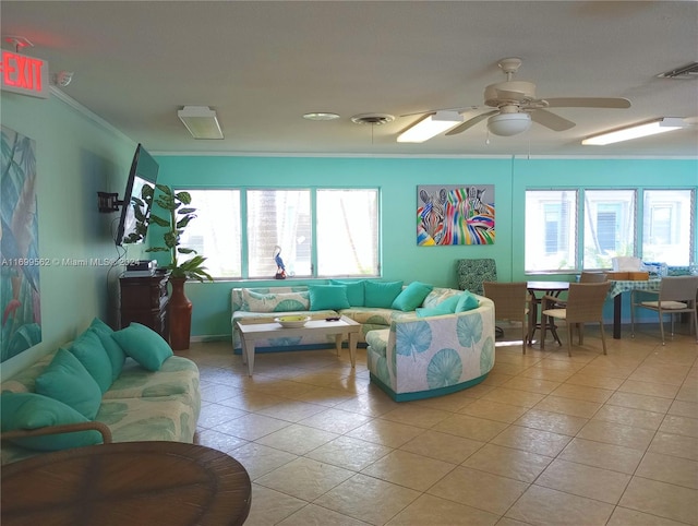 tiled living room featuring ceiling fan and crown molding